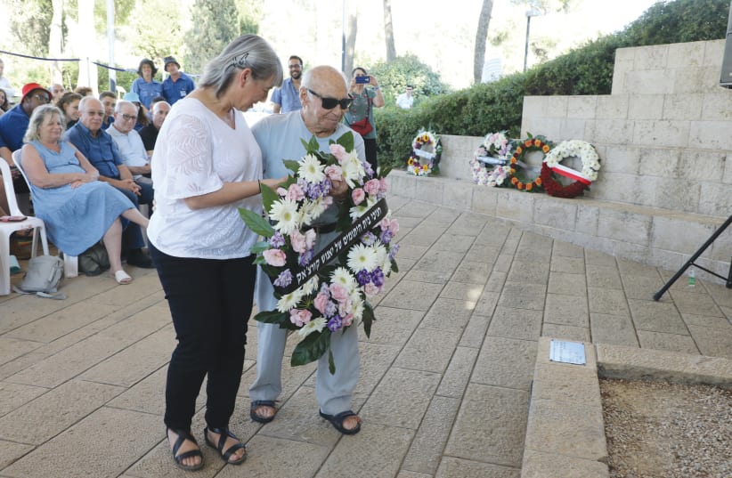 ITZHAK BELFER, who attended school at Janusz Korczak’s orphanage in Warsaw in the 1930s, and Dalia Tauber, chairwoman of the Korczak Educational Institute of Israel, place a wreath on the Janusz Korczak memorial at Yad Vashem. Inset: Janusz Korczak (photo credit: YAD VASHEM/JANUS ASSOCIATION OF THE USA)