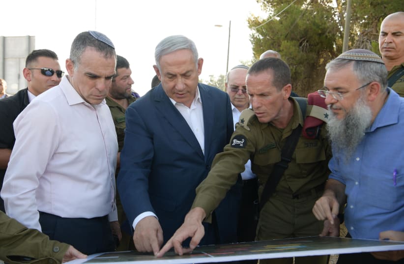 Prime Minister Benjamin Netanyahu toured the location where Dvir Sorek's body was found in Migdal Oz. (photo credit: AMOS BEN-GERSHOM/GPO)