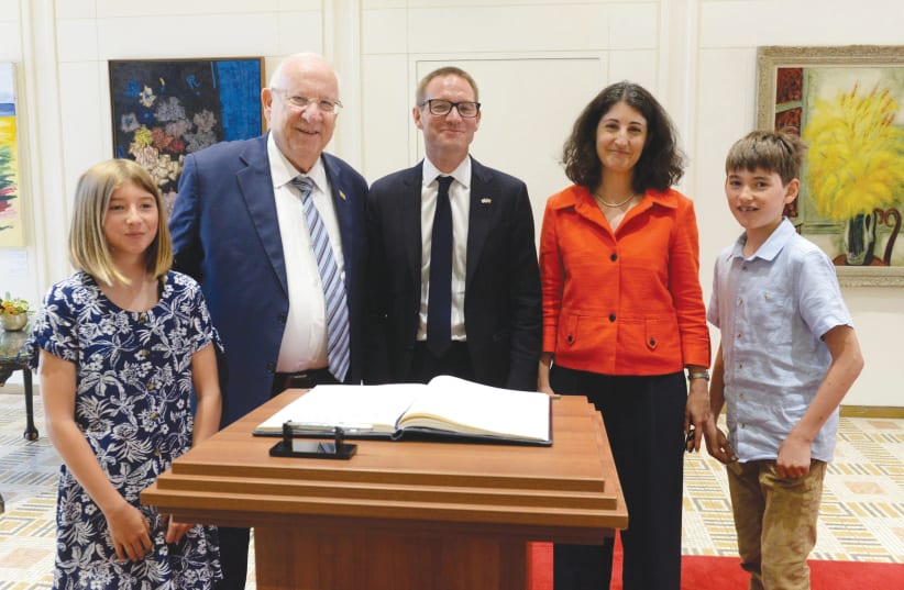 PRESIDENT REUVEN RIVLIN greets UK Ambassador Neil Wigan and his family at the President’s Residence in Jerusalem this week (photo credit: GPO)