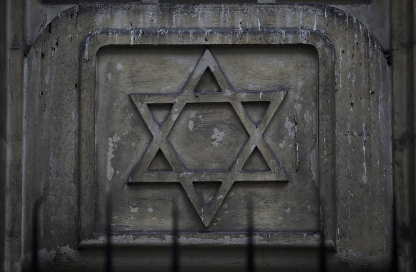 The Star of David is seen on the facade of a synagogue in Paris (photo credit: GONZALO FUENTES / REUTERS)