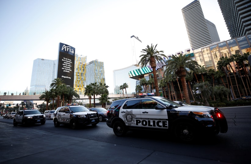 Police vehicles line Las Vegas Boulevard following the mass shooting in Las Vegas, Nevada, U.S., October 4, 2017. (photo credit: REUTERS/CHRIS WATTIE)