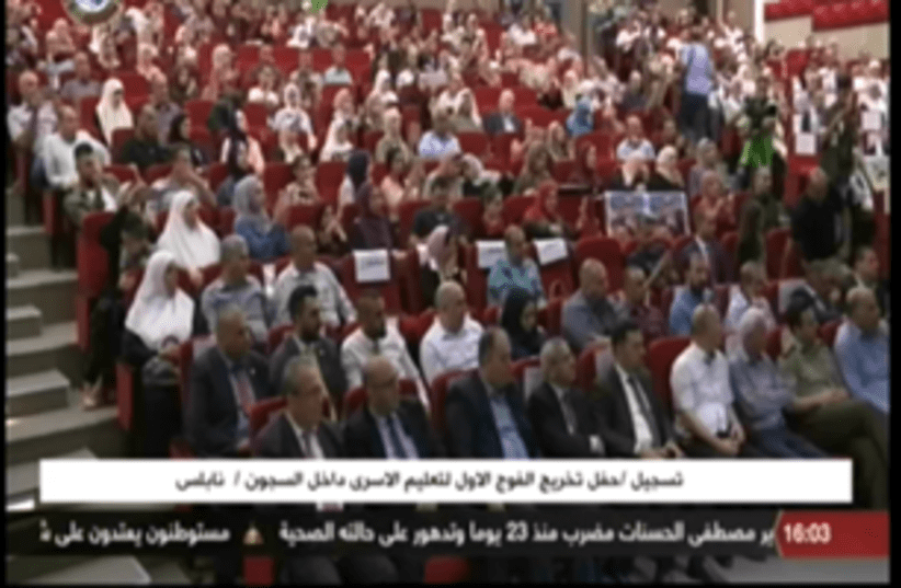 Palestinian prisoner terrorists receive academic degrees at a ceremony broadcast on Palestinian TV (photo credit: PALESTINIAN MEDIA WATCH)