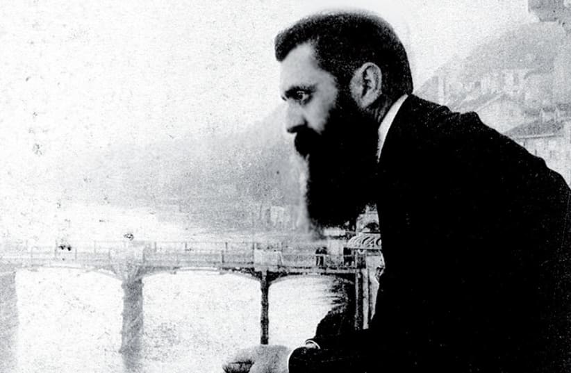 Theodor Herzl leaning over the balcony of the Hotel Les Trois Rois in Basel, Switzerland, probably during the Sixth Zionist Conference there in 1903 (photo credit: JERUSALEM POST ARCHIVE)