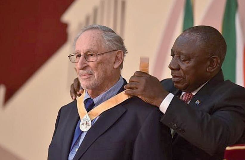 Benjamin Pogrund is awarded the Order of Ikhamqnga in Silver by President Cyril Ramaphosa (photo credit: COURTESY/GCIS/GOVERNMENT OF SOUTH AFRICA)