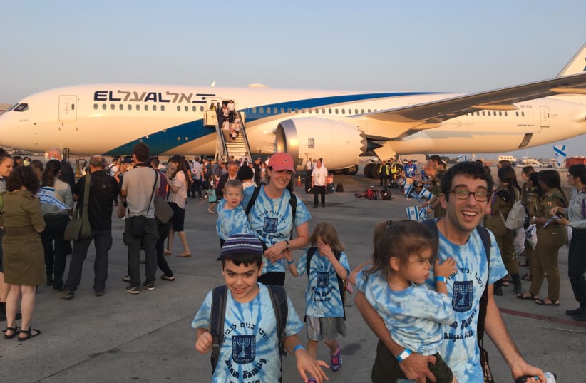 The Blum family steps off the chartered Nefesh B'Nefesh plane in Israel on Wednesday (photo credit: MENACHEM SHLOMO)