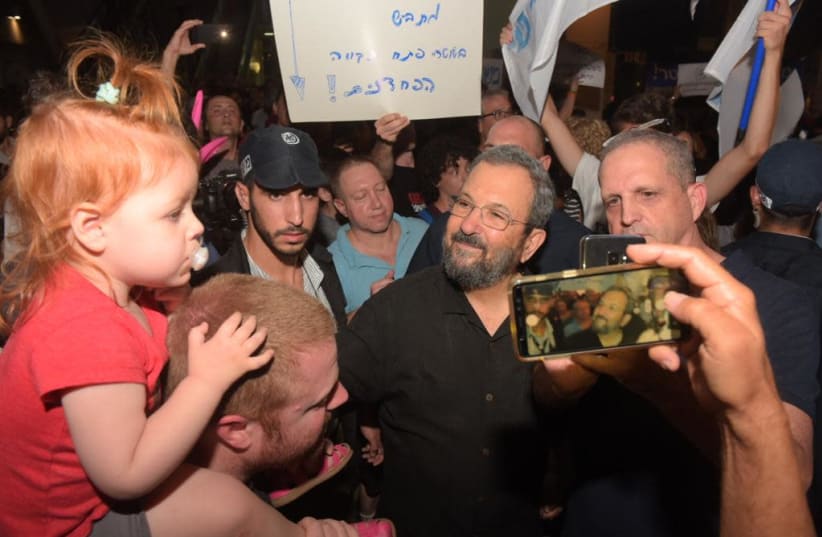 Former prime minister Ehud Barak attends protests against Attorney-General Avichai Mandelblit. (photo credit: AVSHALOM SASSONI)