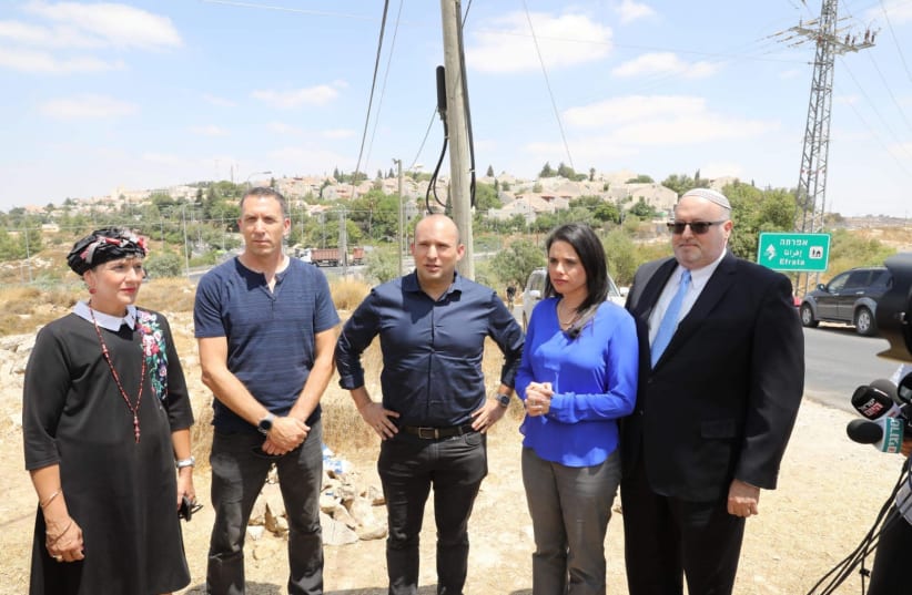 New Right leaders Naftali Bennett and Ayelet Shaked at the sight where a terrorist killed Dvir Sorek in West Bank (photo credit: MARC ISRAEL SELLEM/THE JERUSALEM POST)