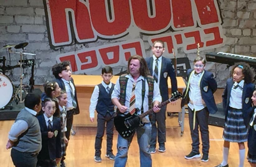 TAL FRIEDMAN and some of his young costars in ‘School of Rock.’ (photo credit: SHANNA FULD)