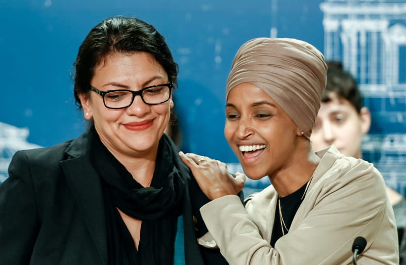 U.S. Representatives Rashida Tlaib (D-MI) and Ilhan Omar (D-MN) react as they discuss travel restrictions to Palestine and Israel during a news conference at the Minnesota State Capitol Building in St Paul, Minnesota, August 19, 2019 (photo credit: CAROLINE YANG/REUTERS)