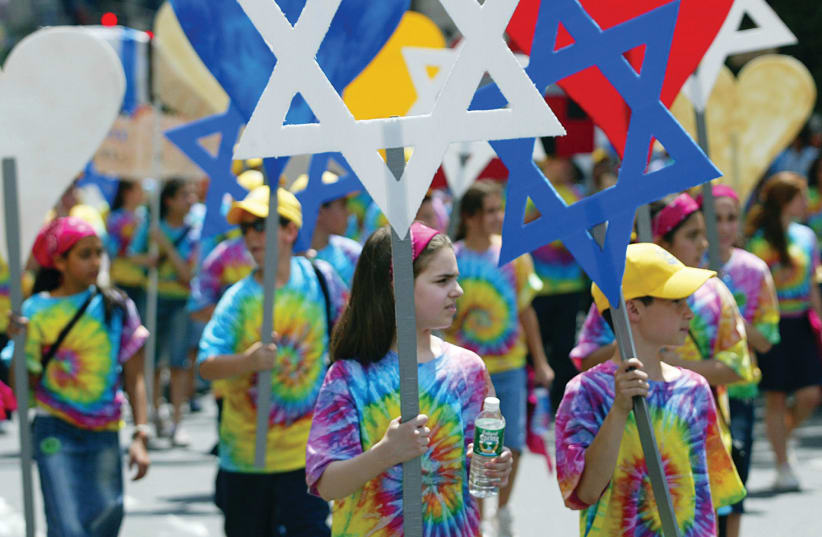 SUPPORTERS OF Israel at a parade in New York City in 2005. Fourteen years later, how have things changed? (photo credit: REUTERS)
