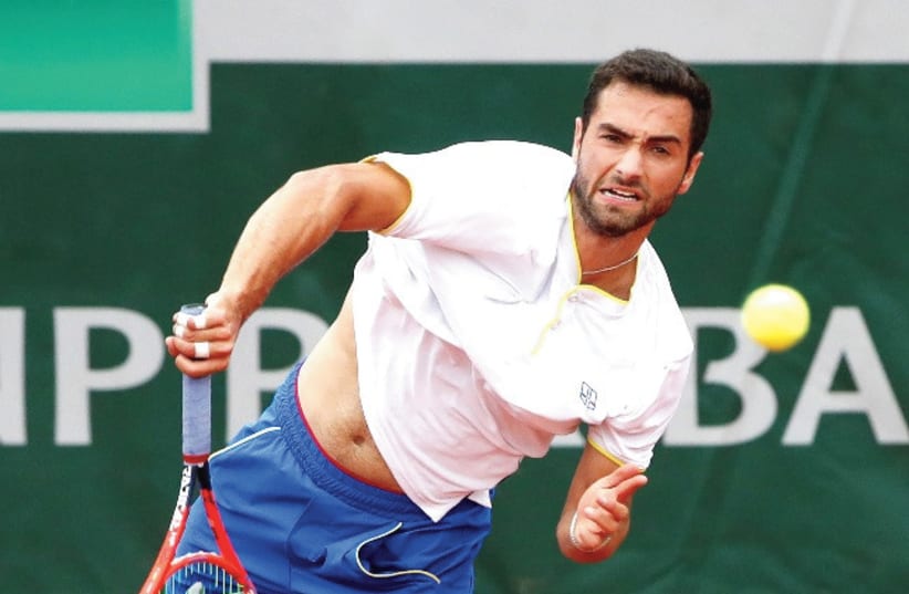 NOAH RUBIN, hoping to qualify for the US Open, which begins next week, has shone a light on personal issues facing professional tennis players (photo credit: REUTERS)