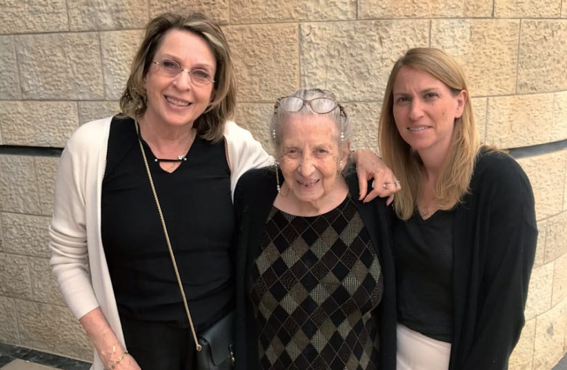 Masha Greenbaum in the center with her daughter Ettie Kornbluth and granddaughter Nava Horowitz, at the Holocaust Remembrance Day Yiddish ceremony at the Jerusalem Theater earlier this year (photo credit: ROBERT HERSOWITZ)