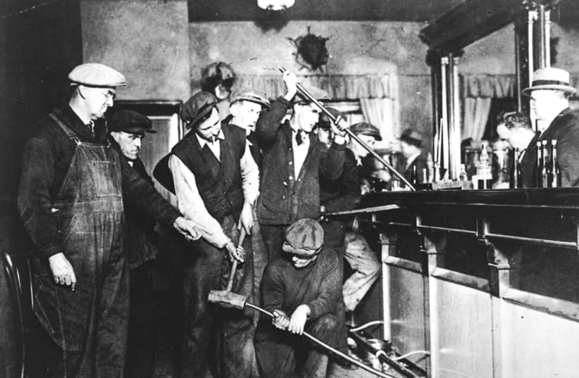 US Prohibition agents destroy a bar  (photo credit: REUTERS/ US INFORMATION AGENCY)