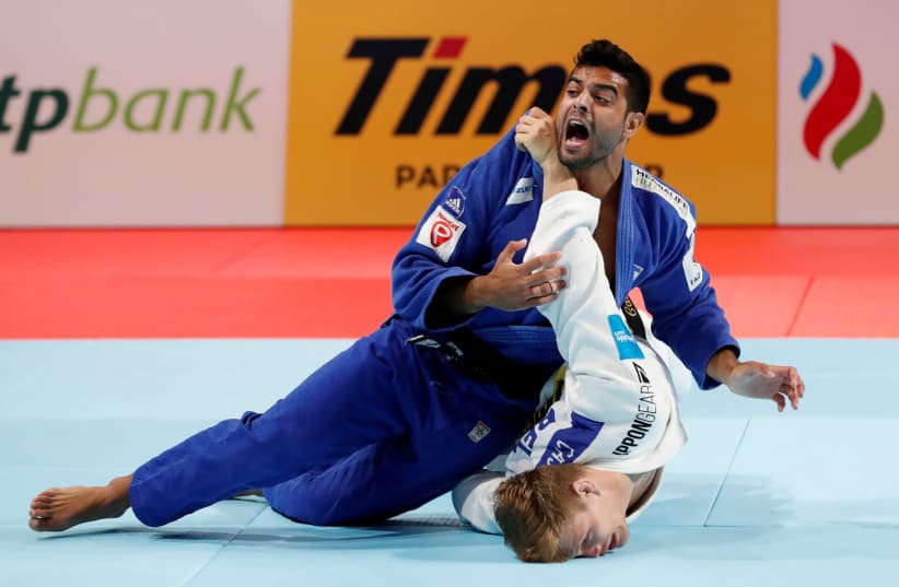  Israel's Sagi Muki and Belgium's Matthias Casse compete (photo credit: REUTERS/KIM KYUNG-HOON)