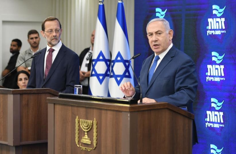 Prime Minister Benjamin Netanyahu and Zehut party leader Moshe Feiglin hold a press conference announcing Zehut's withdrawal from the elections. (photo credit: AVSHALOM SASSONI)