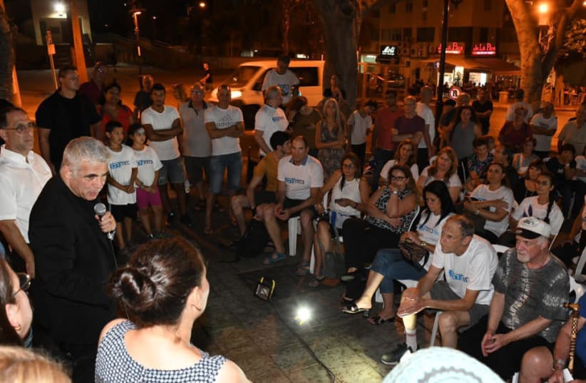 Blue and White rally in Rehovot on August 29, 2019. Shots were fired with an air pistol. (photo credit: ELAD GUTTMAN)