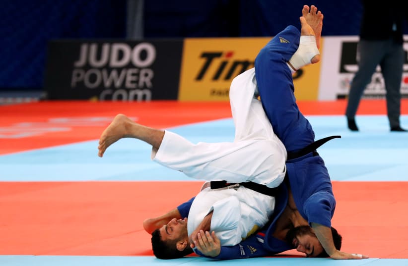 Judo - World Judo Championships - Men's Under 81 kg - Nippon Budokan, Tokyo, Japan - August 28, 2019 - Iran's Saeid Mollaei and Russia's Khasan Khalmurzaev compete.  (photo credit: REUTERS)