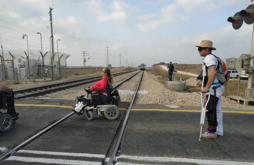 Disabled Israelis protest by blocking train tracks near Shfayim. (photo credit: DISABLED BECOME PANTHERS)
