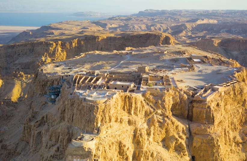 AERIAL VIEW of Masada in the Judaean Desert, with the Dead Sea in the distance. (photo credit: Wikimedia Commons)
