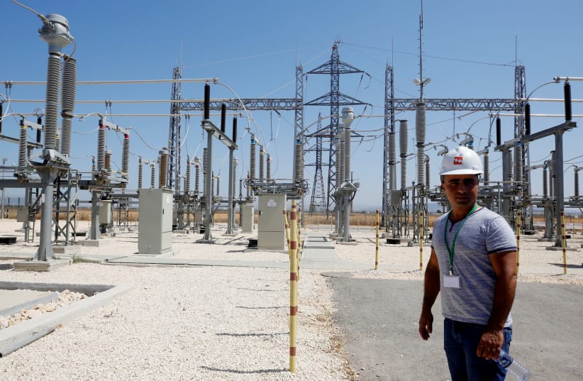 Israeli engineer stands in the new electrical substation near the West Bank city of Jenin (photo credit: ABED OMAR QUSINI/REUTERS)