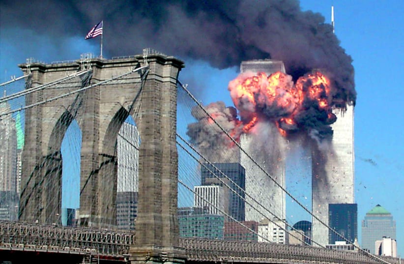 Second tower of the World Trade Center bursting into flames after being hit by an airplane in New York on September 11, 2001 (photo credit: STR NEW/REUTERS)