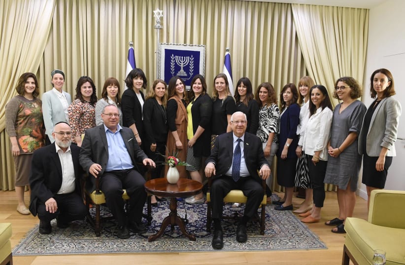President Reuven Rivlin with representatives of Movilot (photo credit: MARC NEYMAN/GPO)