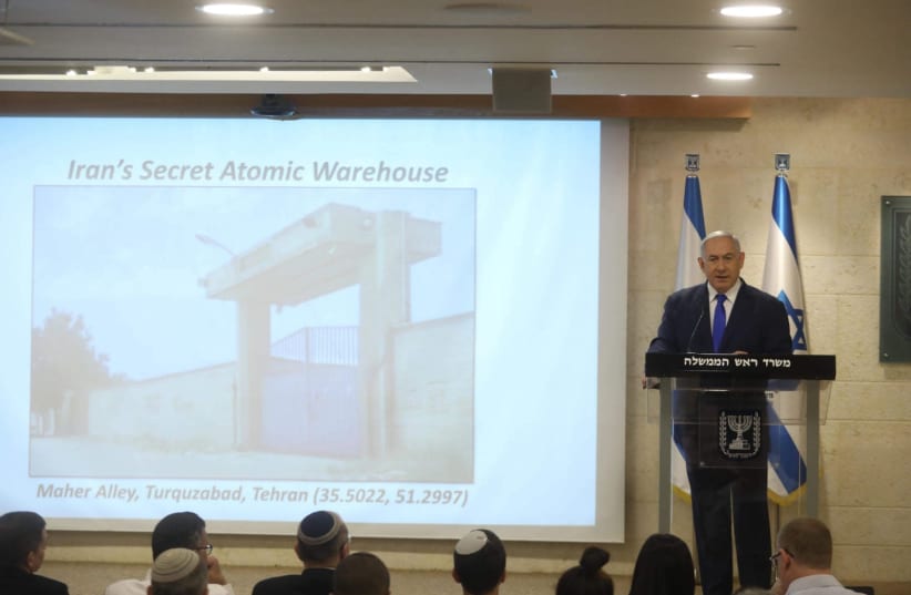 Prime Minister Benjamin Netanyahu reveals the Iranian nuclear bases uncovered by Israel.  (photo credit: MARC ISRAEL SELLEM)