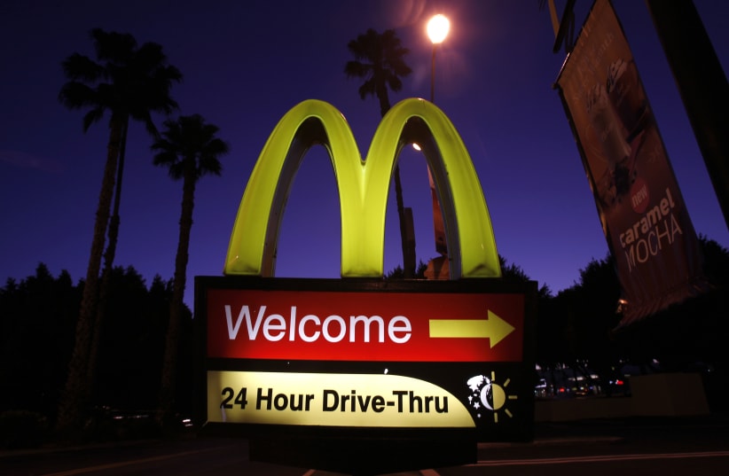 A McDonald's restaurant's drive-thru sign is pictured in Los Angeles April 4, 2011. Fast-food chain McDonald's Corp, trying to grab positive headlines in an economic recovery still struggling to create living-wage jobs, announced on Monday that it would do all of its spring hiring in one fell swoop. (photo credit: MARIO ANZUONI/REUTERS)