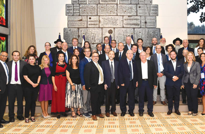 PRESIDENT REUVEN RIVLIN with founding members of Our Common Destiny. (photo credit: HAIM ZACH/GPO)