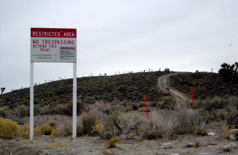 Warning sign near secret Area 51 base in Nevada. (photo credit: Wikimedia Commons)