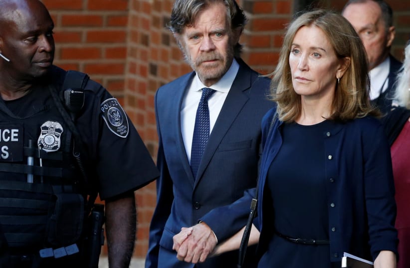 Actress Felicity Huffman and husband William H. Macy leave the federal courthouse in Boston (photo credit: REUTERS)