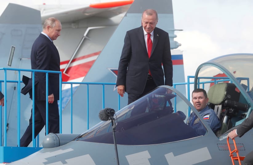 Russian President Vladimir Putin and Turkish President Recep Tayyip Erdogan inspect Sukhoi Su-57 fifth-generation fighter during the MAKS-2019 International Aviation and Space Salon in Zhukovsky outside Moscow, Russia, August 27, 2019. (photo credit: MAXIM SHIPENKOV/POOL VIA REUTERS/FILE PHOTO)