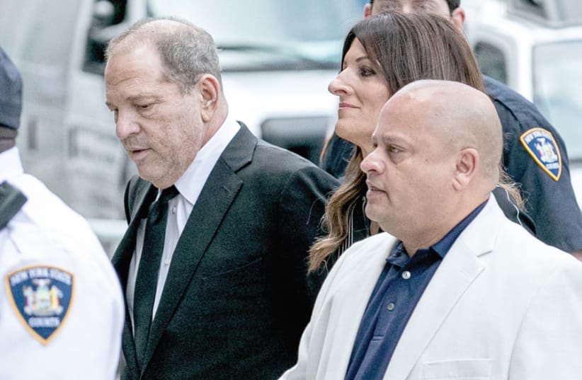 FILM PRODUCER Harvey Weinstein (left) arrives at New York Supreme Court for the arraignment in his sexual assault case in August. (photo credit: JEENAH MOON/REUTERS)