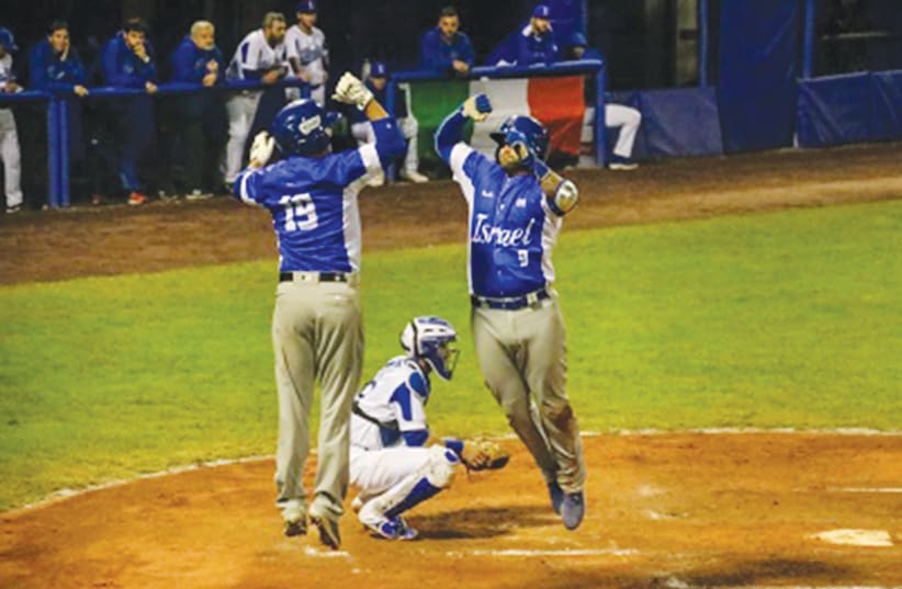 TEAM ISRAEL’S Nick Rickles and Danny Valencia celebrate during their game Friday against Italy. (photo credit: MARGO SUGARMAN)