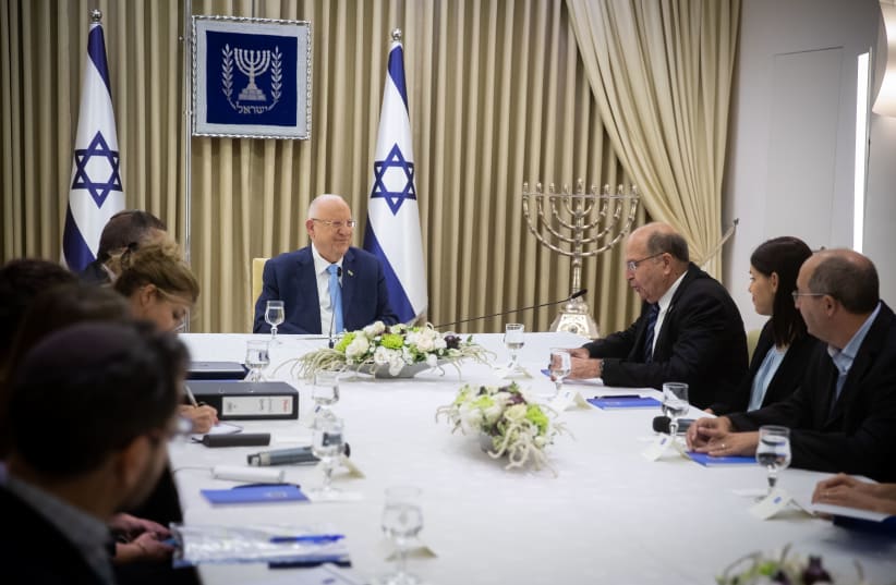 President Rivlin with members of Blue and White (photo credit: YONATAN SINDEL/FLASH90)