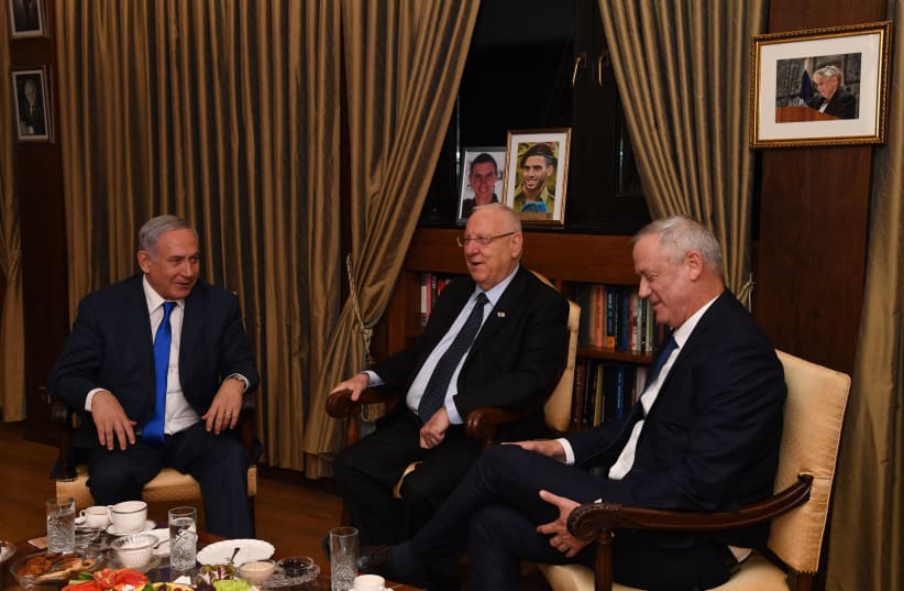Prime Minister Benjamin Netanyahu, President Reuven Rivlin and Blue and White leader Benny Gantz meet after to discuss the formation of the new government, Setepmber 23 2019  (photo credit: CHAIM TZACH/GPO)