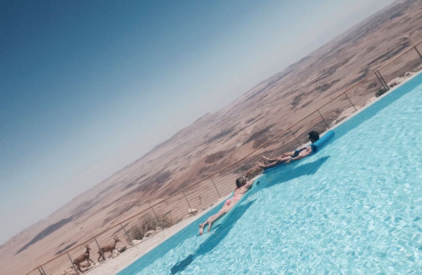 RELAX ON a raft at the edge of the Ramon Crater, at Beresheet. (photo credit: SHARON FEIEREISEN)