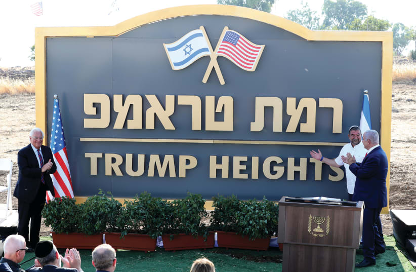PRIME MINISTER Benjamin Netanyahu and US Ambassador David Friedman attend a ceremony to unveil a sign for a new Golan Heights community named after US President Donald Trump, in June. (photo credit: AMMAR AWAD / REUTERS)