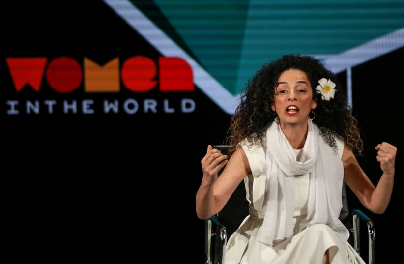 Masih Alinejad, Iranian journalist and women's rights activist, speaks on stage at the Women In The World Summit in New York, U.S, April 12, 2019 (photo credit: REUTERS)