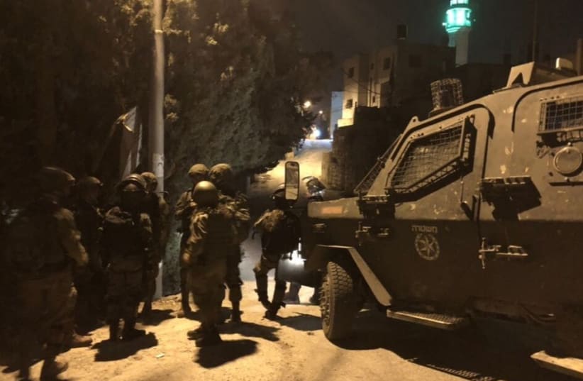 IDF soldiers preparing for a raid in Kfar Ni'ma, near Modiin (photo credit: ANNA AHRONHEIM)