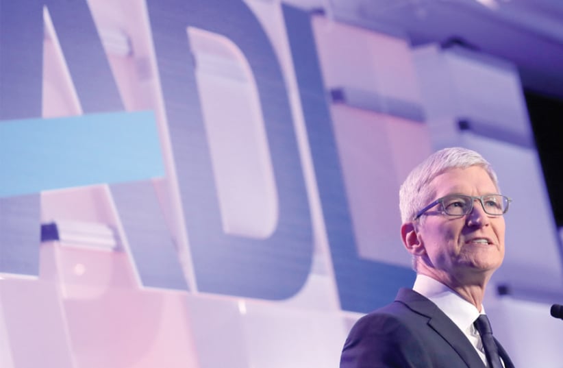 APPLE CEO Tim Cook speaks at the Anti-Defamation League’s ‘Never is Now’ summit in New York in December 2018. (photo credit: BRENDAN MCDERMID/REUTERS)