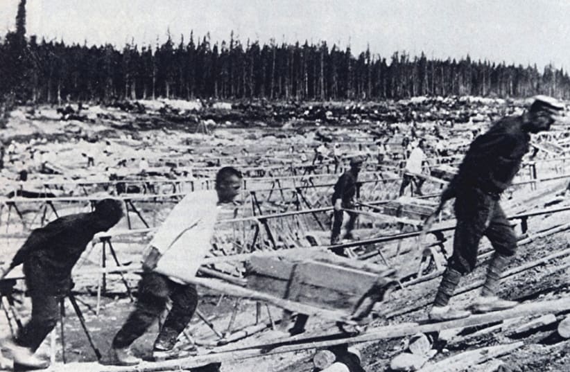 PRISONERS LABOR at the site of Belomorkanal, the man-made channel connecting the White Sea and Baltic Sea that was constructed by Soviet Gulag inmates. Tzvi Netzer served a full year in the infamous Siberian Gulag. (photo credit: Wikimedia Commons)