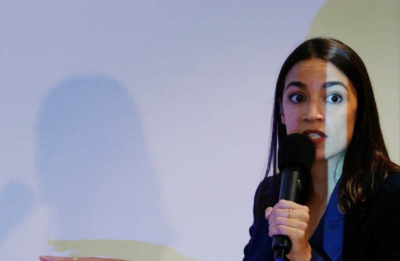 U.S. Rep. Alexandria Ocasio-Cortez (D-NY) speaks during a town hall in New York (photo credit: LUCAS JACKSON/REUTERS)