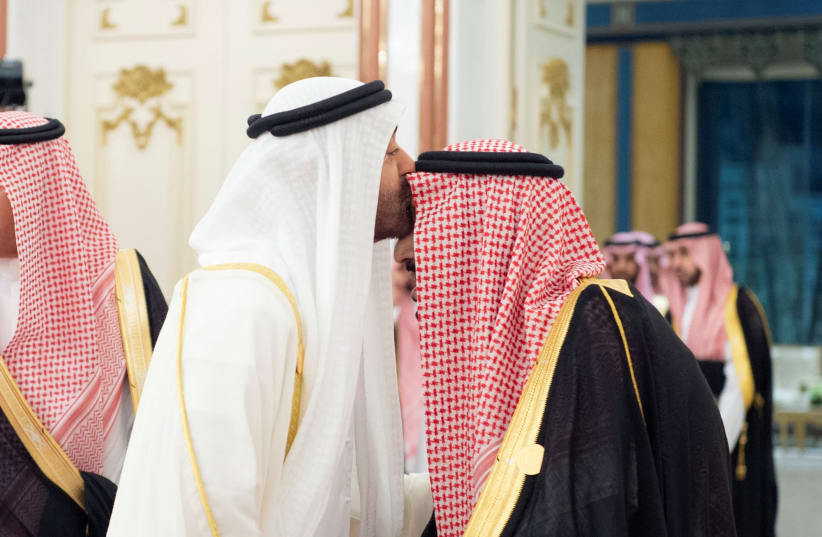 Abu Dhabi's Crown Prince Sheikh Mohammed bin Zayed al-Nahyan kisses the forehead of Saudi Arabia's King Salman bin Abdulaziz during the Gulf Cooperation Council (GCC) summit in Mecca, Saudi Arabia May 30, 2019 (photo credit: BANDAR ALGALOUD/COURTESY OF SAUDI ROYAL COURT/HANDOUT VIA REUTERS)