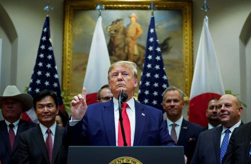 U.S. President Donald Trump speaks about Turkey and Syria during a formal signing ceremony for the U.S.-Japan Trade Agreement at the White House in Washington, October 7, 2019 (photo credit: REUTERS/KEVIN LAMARQUE)