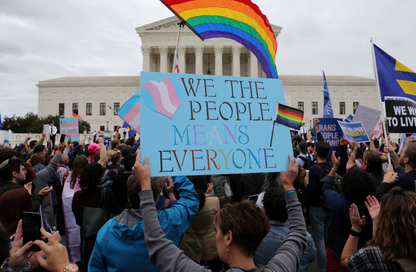 LGBTQ activists and supporters rally outside the U.S. Supreme Court in Washington (photo credit: JONATHAN ERNST / REUTERS)
