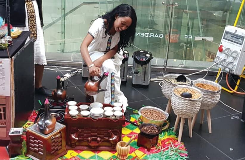 MOST COFFEE in Ethiopia is enjoyed outdoors thanks to the Buna-Ladies who make it on the spot. This was an attempt to see if Israelis will also be open to the experience (photo credit: Courtesy)