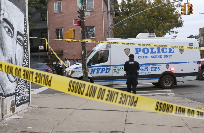 Police are pictured on the scene of a shooting at Triple A Aces club in the Brooklyn borough of New York City, New York, U.S., October 12, 2019 (photo credit: REUTERS/LLOYD MITCHELL)