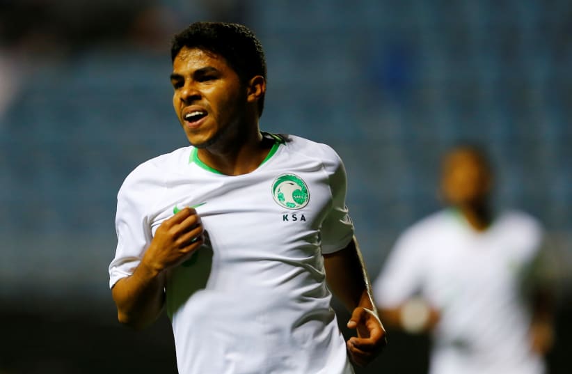 Saudi Arabia's Yahya Al-Shehri celebrates scoring a goal in this 2018 picture  (photo credit: MARCELO DEL POZO/REUTERS)