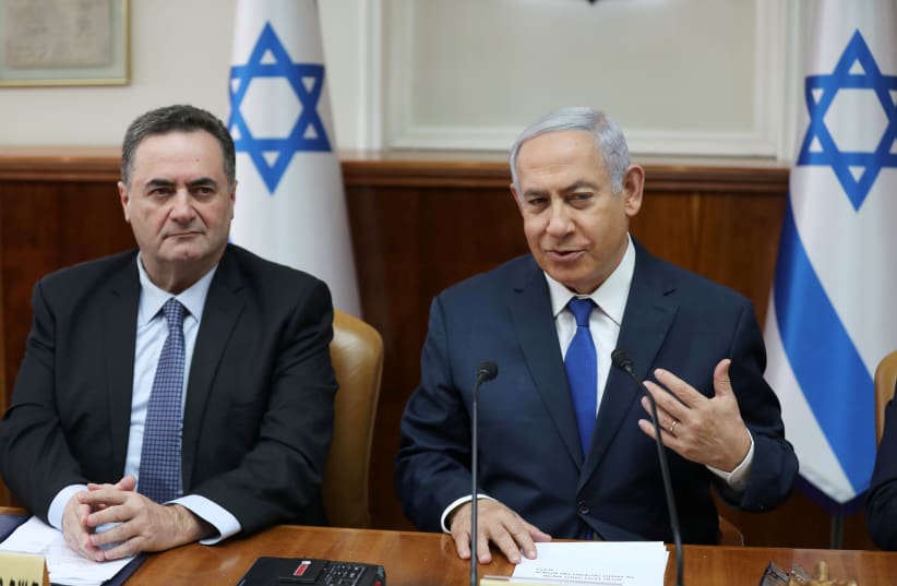 Israeli Prime Minister Benjamin Netanyahu sits next to foreign minister Israel Katz during a cabinet meeting (photo credit: REUTERS)